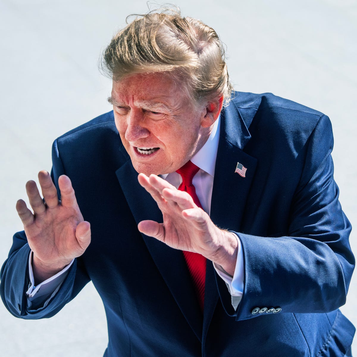 Donald Trump wearing a navy blue suit