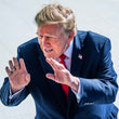 Donald Trump wearing a navy blue suit